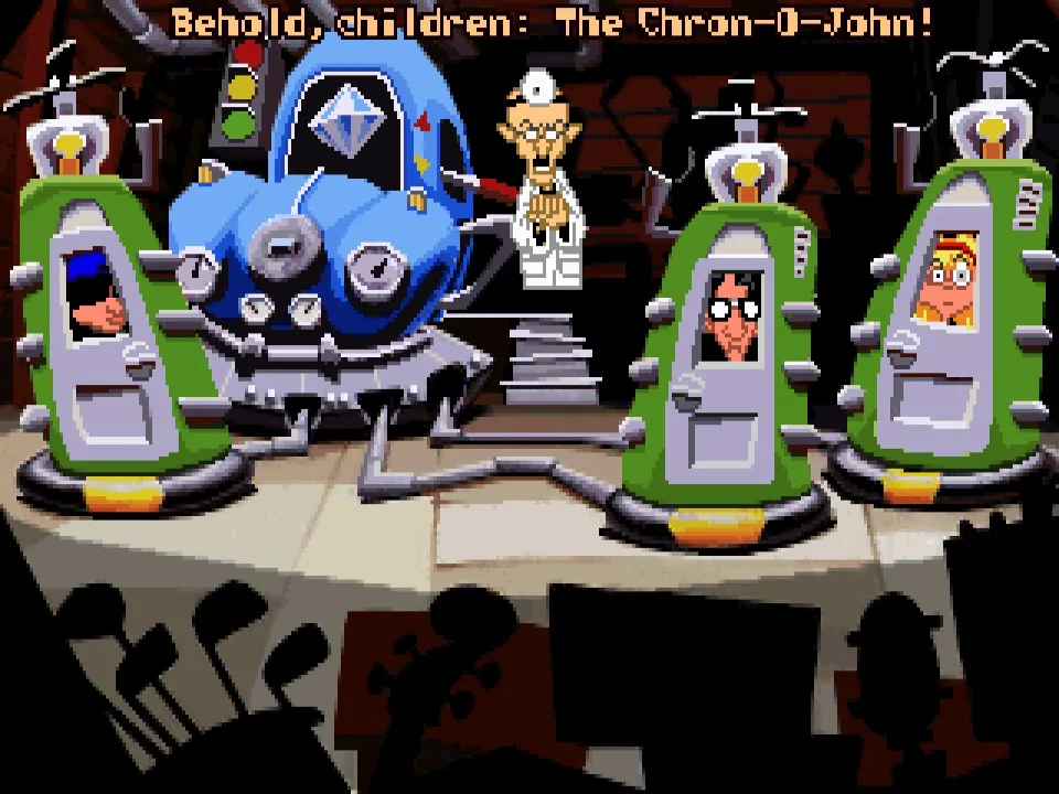 A screenshot from Day of the Tentacle. A trailblazing scientist is introducing three local teenagers to his latest invention: the Chron-O-John. The teens have been crammed into three specially modified portable toilets, and are about to go on an amazing journey through time.