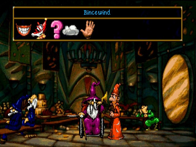 A screenshot of the original Discworld adventure game. Rincewind (a wizard) is talking to Windle Poons (a much older wizard, in a wheelchair). A UI pane at the top of the screen invites the player to choose what kind of sentiment they want Rincewind to express.